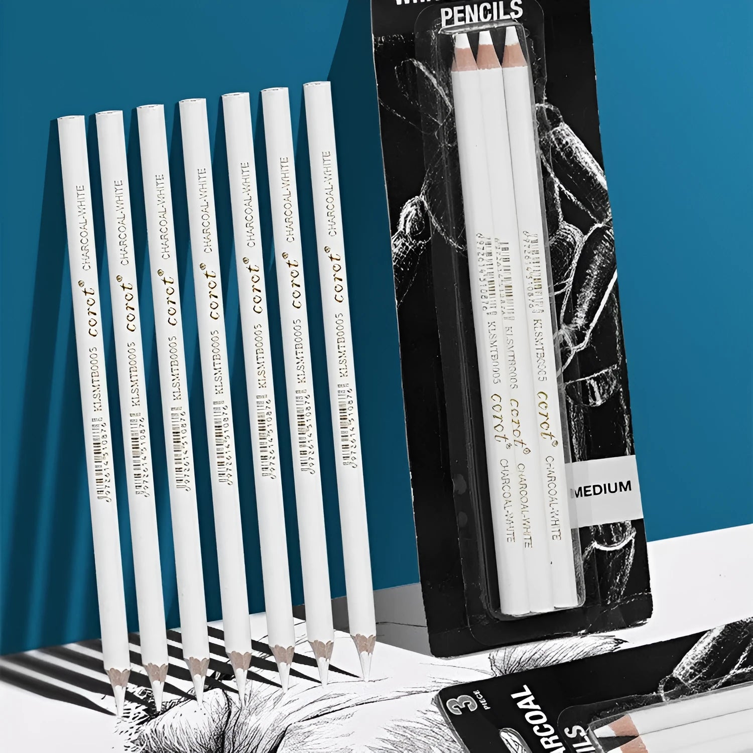 Set of three white charcoal pencils with wooden barrels for highlighting and sketching