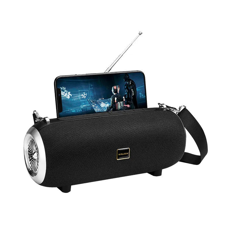F666 square portable Bluetooth speaker with shoulder strap, showing retractable FM antenna and control buttons.