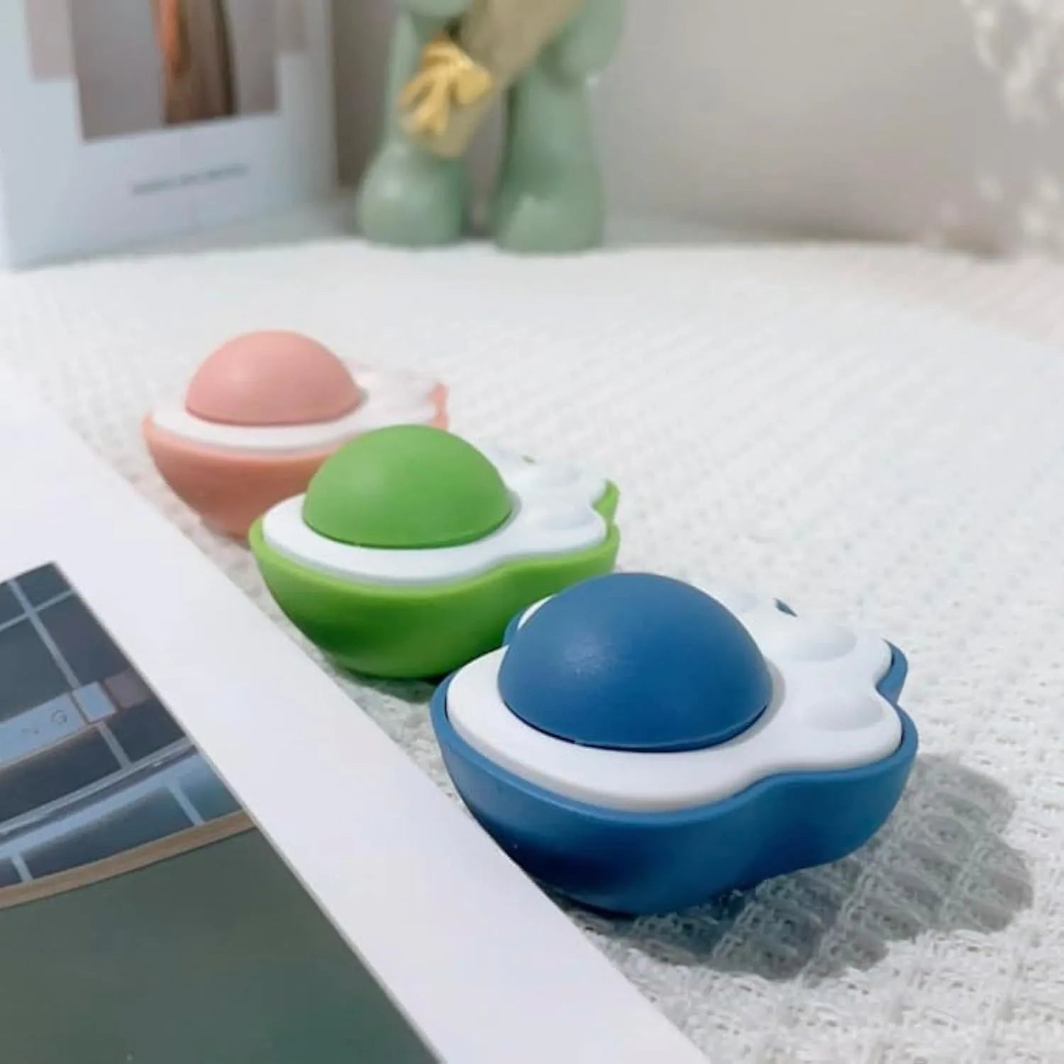 Plush catnip balls for cats in blue, green, and pink colours for interactive play and dental health
