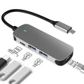 USB-C 7-in-1 expansion dock with HDMI port, multiple USB ports, and a 15cm black cable.