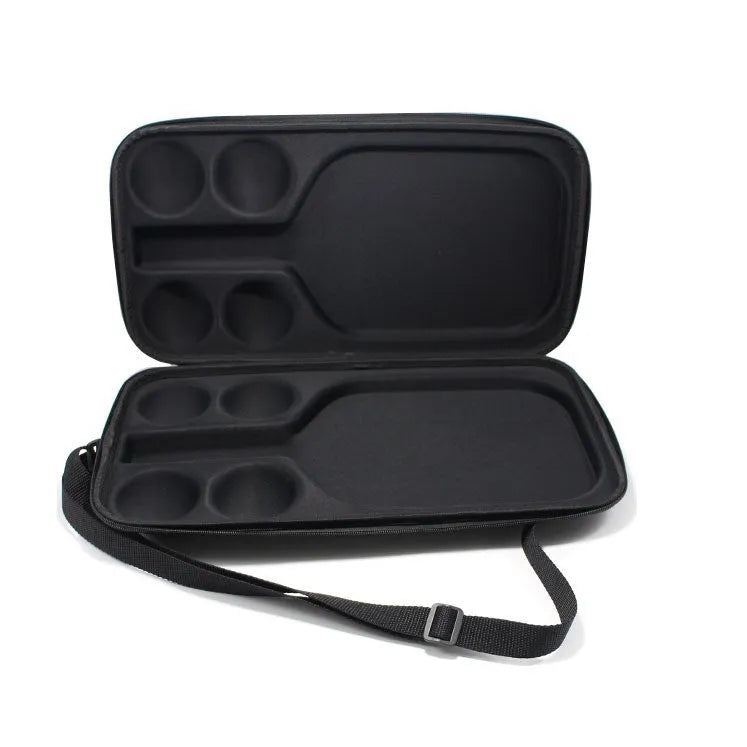 Black EVA pickleball storage bag with shoulder straps, holding one paddle and four balls.