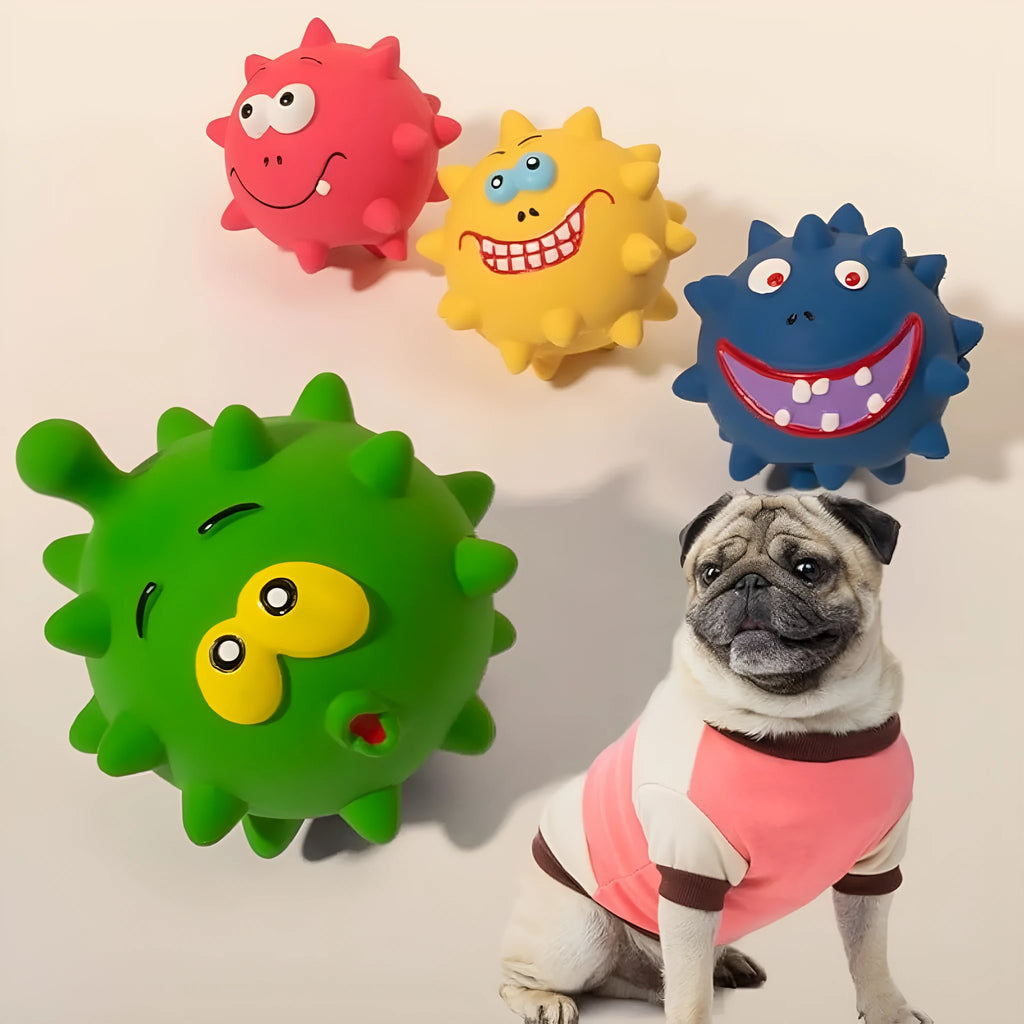 Four colourful squeaky dog balls with textured surfaces and cute faces