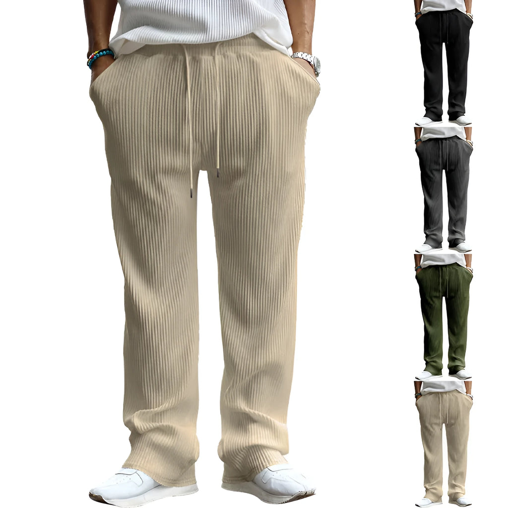 Man wearing loose high-waisted straight-leg casual trousers in army green.