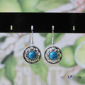 Miao silver ethnic earrings with turquoise geometric flower disk and auspicious patterns