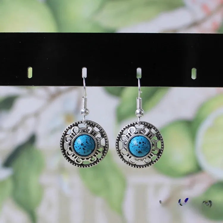 Miao silver ethnic earrings with turquoise geometric flower disk and auspicious patterns