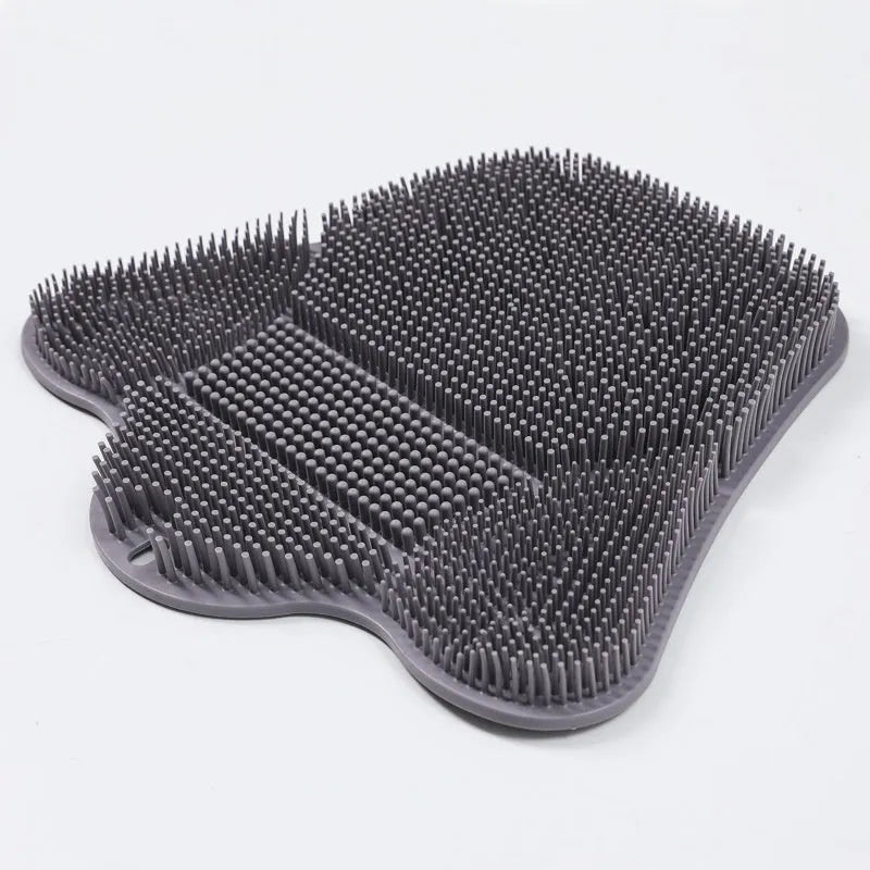 Blue silicone bath massage mat with long handle for back scrubbing.