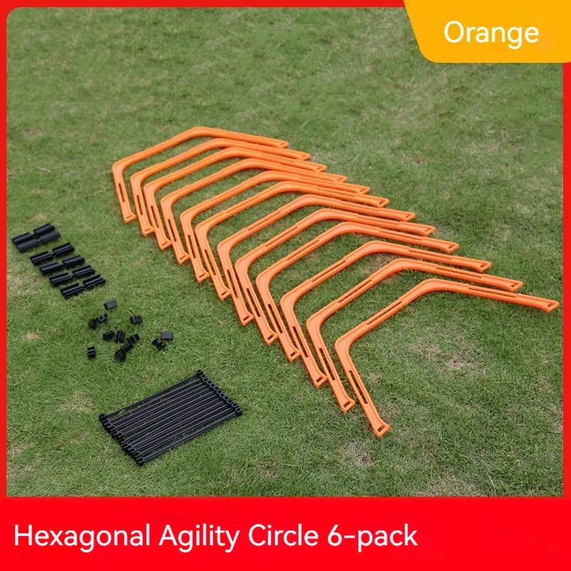 Set of six foldable yellow green and orange hexagon football agility training rings on grass