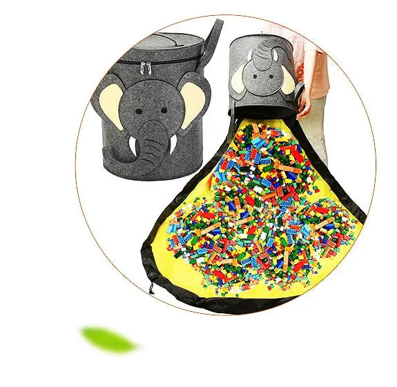 Green cube-shaped felt storage bag with a pull rope, shown as a toy organiser and play mat.