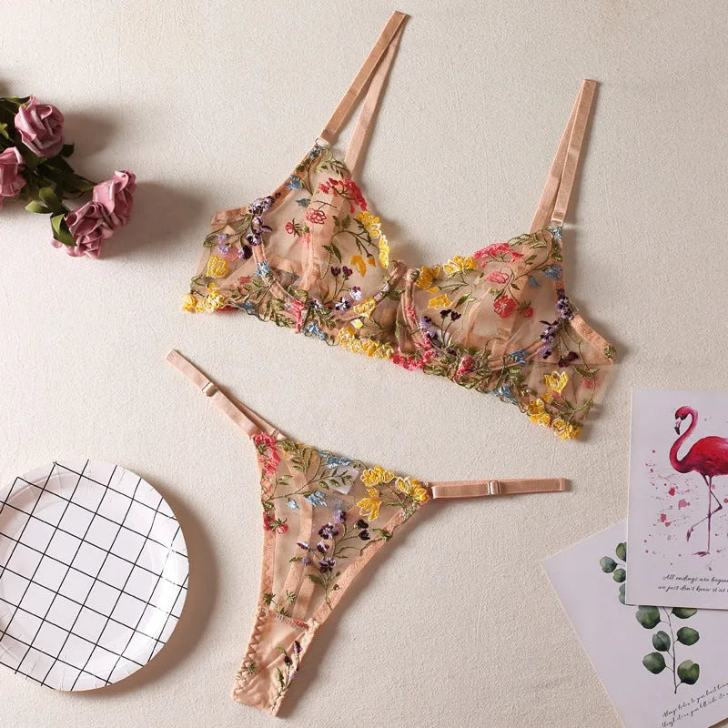 Women's floral underwear bikini set in polyester fabric, shown in skin colour, purple, black, yellow, and pink colour options.