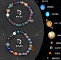Two natural stone beaded bracelets with adjustable cords on a wooden surface, showing zodiac symbol designs.