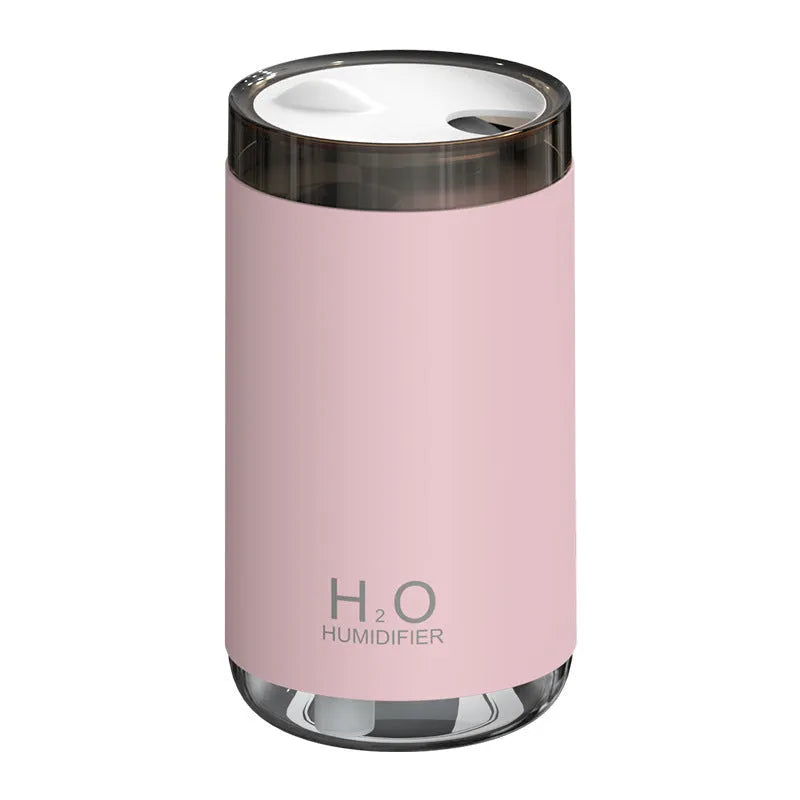 Jellyfish-shaped humidifier producing smoke ring mist with warm night light illumination