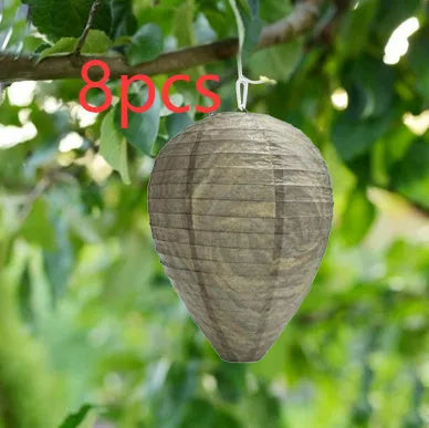 Gold beehive shaped paper lantern with honeycomb texture, shown hanging.