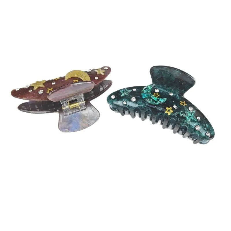 Oversized star moon barrettes with starry sky patterns in multiple colour options