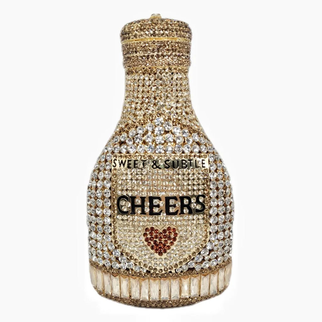 Gold rhinestone evening clutch bag shaped like a champagne bottle with a hard frame.