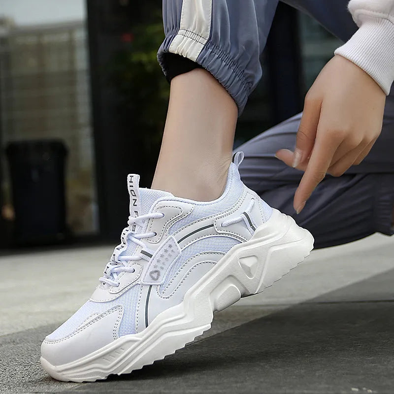 White women's casual mesh sports shoes with a buckle and thick sole.