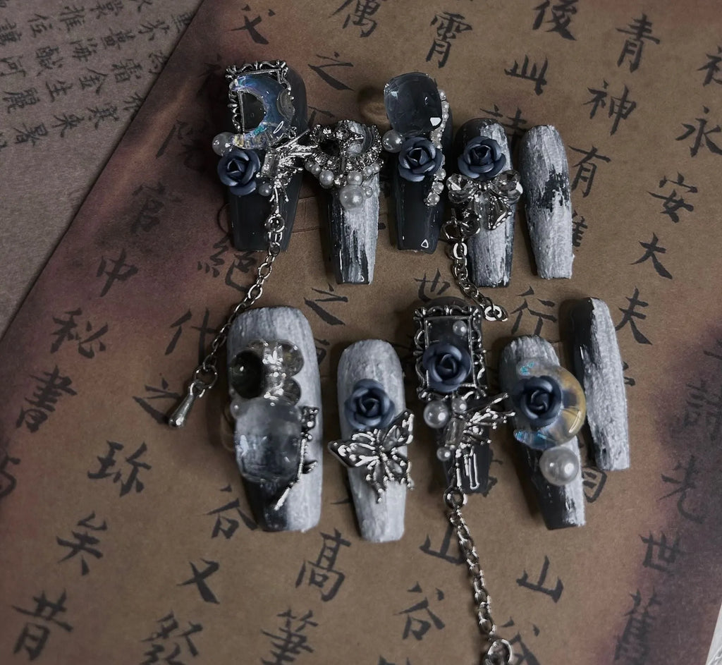 Evening manicure set in heavy industry night blue with rose, tulip, and flower patterns on plastic armour suit