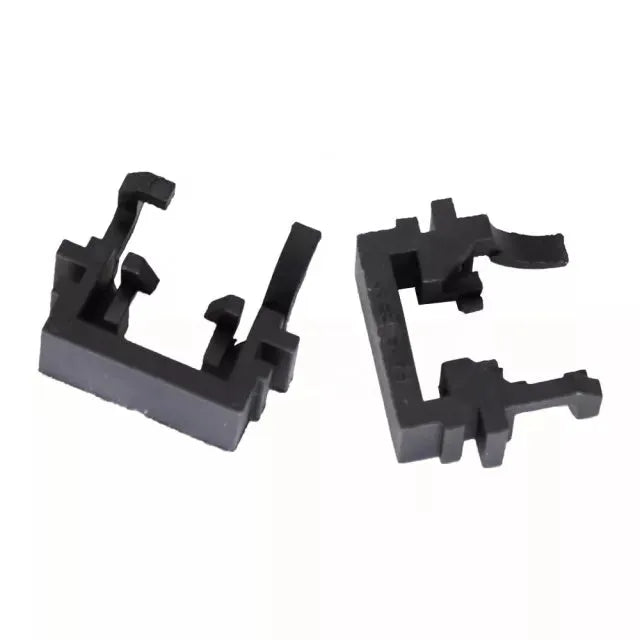 Black plastic H1 to LED headlight conversion adapter for Ford cars, showing clip mechanism.