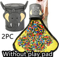Green cube-shaped felt storage bag with a pull rope, shown as a toy organiser and play mat.