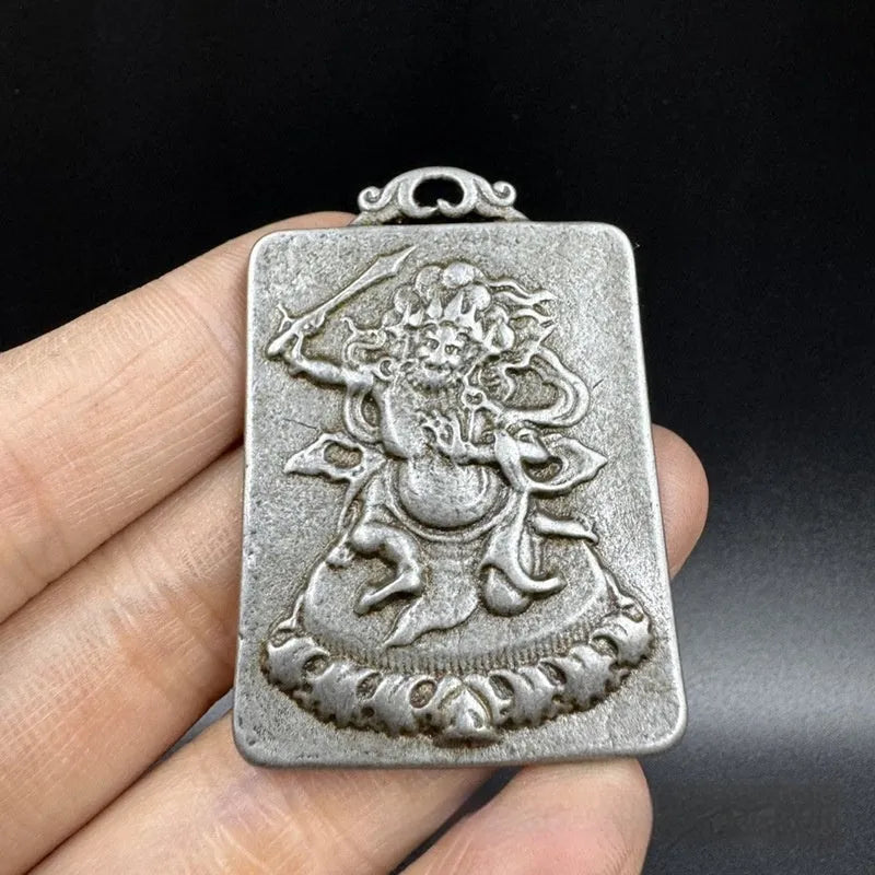 Iron metal pendant with Chinese geometric design depicting Yamantaka Aryaacalanatha deity