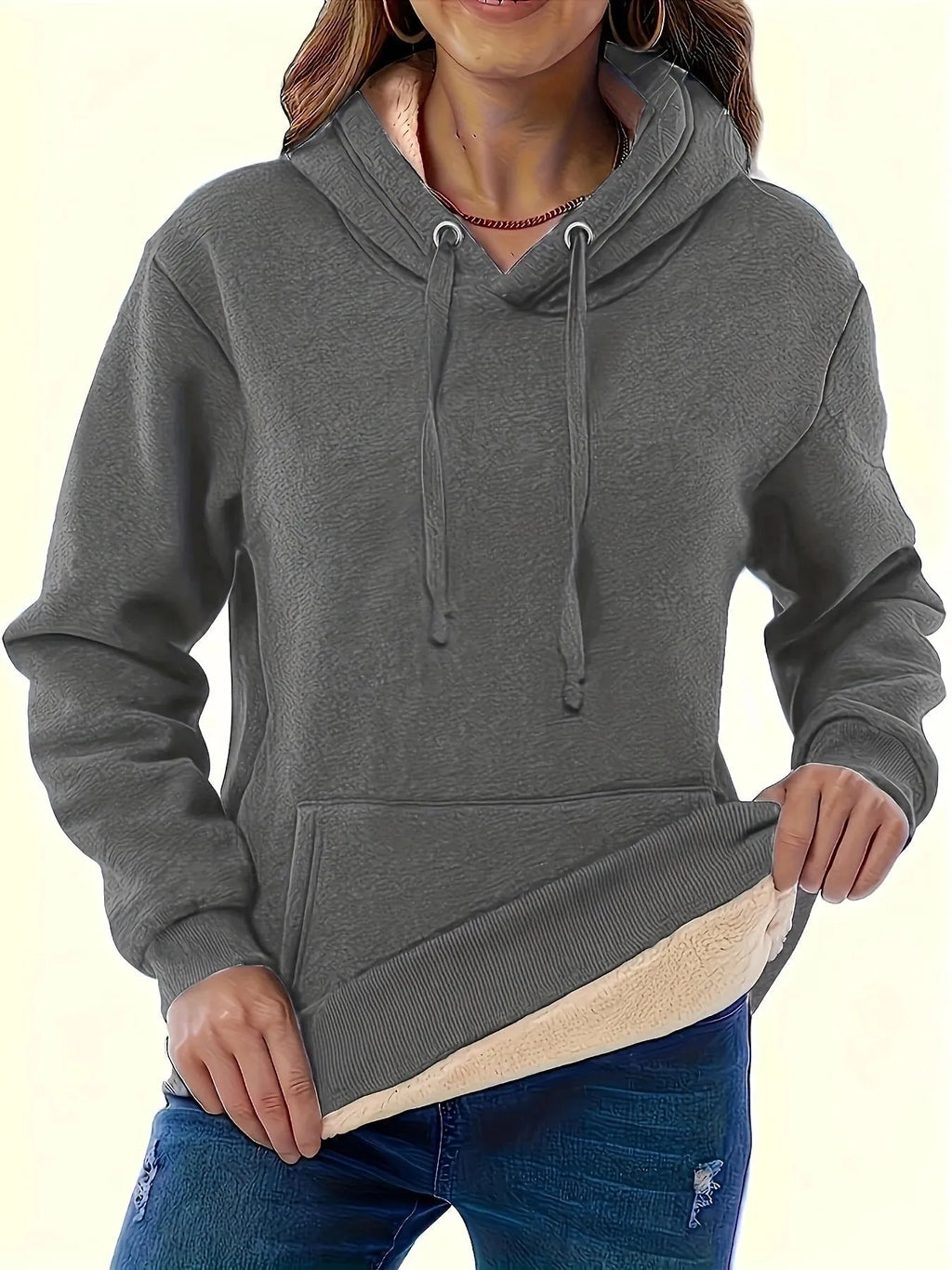 Women's loose black hooded sweater with pockets and a textured 3D pattern