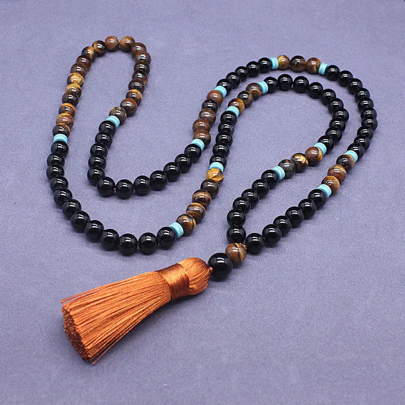 Agate and tiger's eye stone jewellery set with black bracelet and tiger-shaped pendant necklace