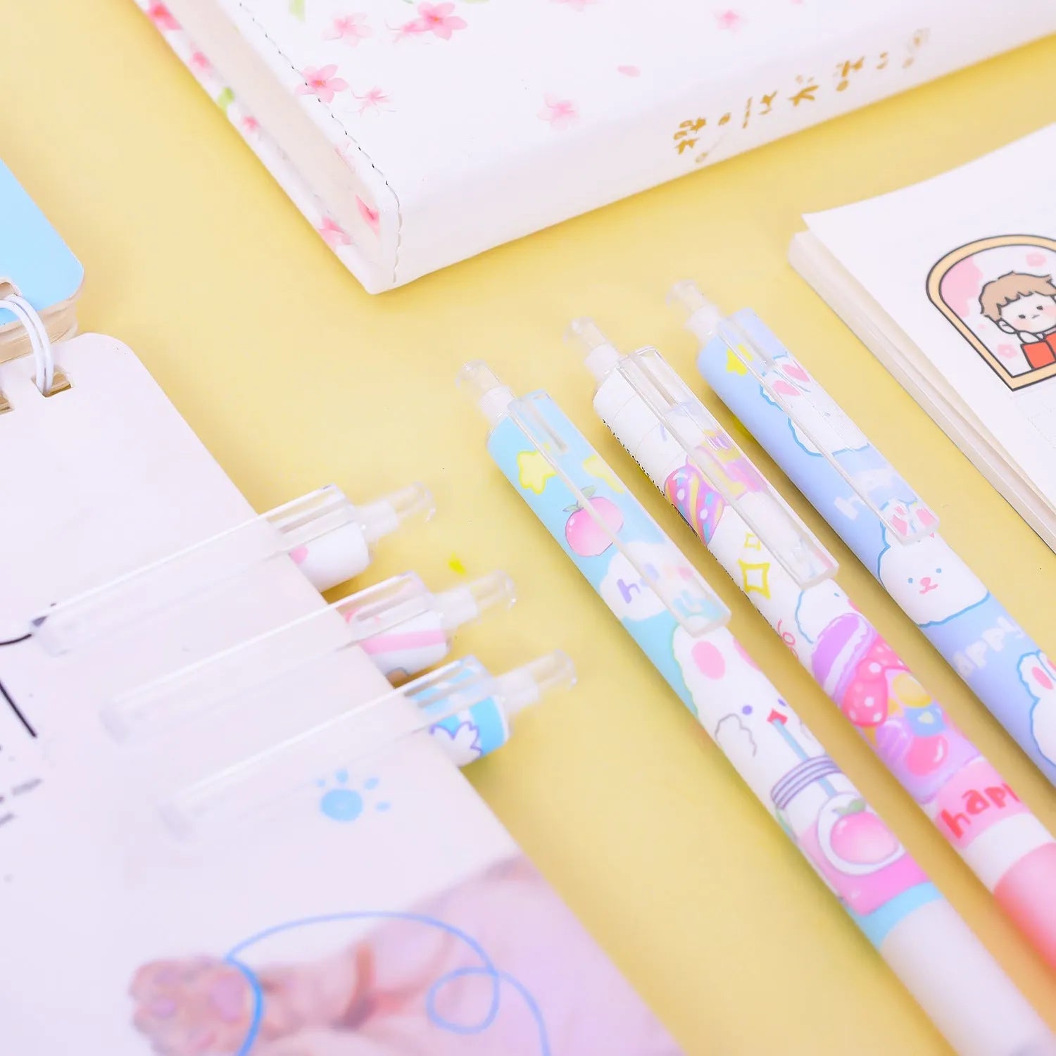 Six black ballpoint pens with cartoon bunny design and 0.5mm tips in packaging