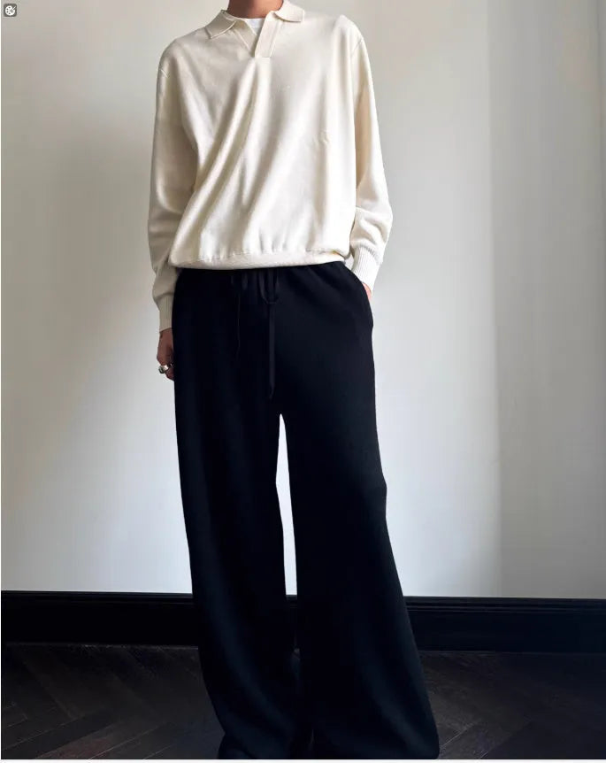 Man's milky white pure wool polo sweater with a lapel collar, shown in a loose fit.