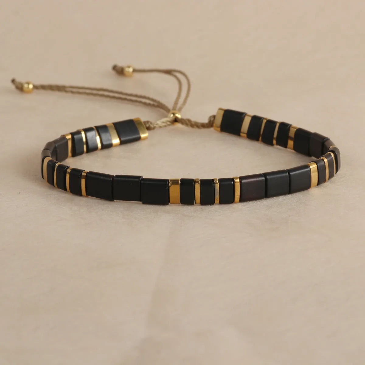 Geometric glass bead bracelet with pull bead closure in five colour options