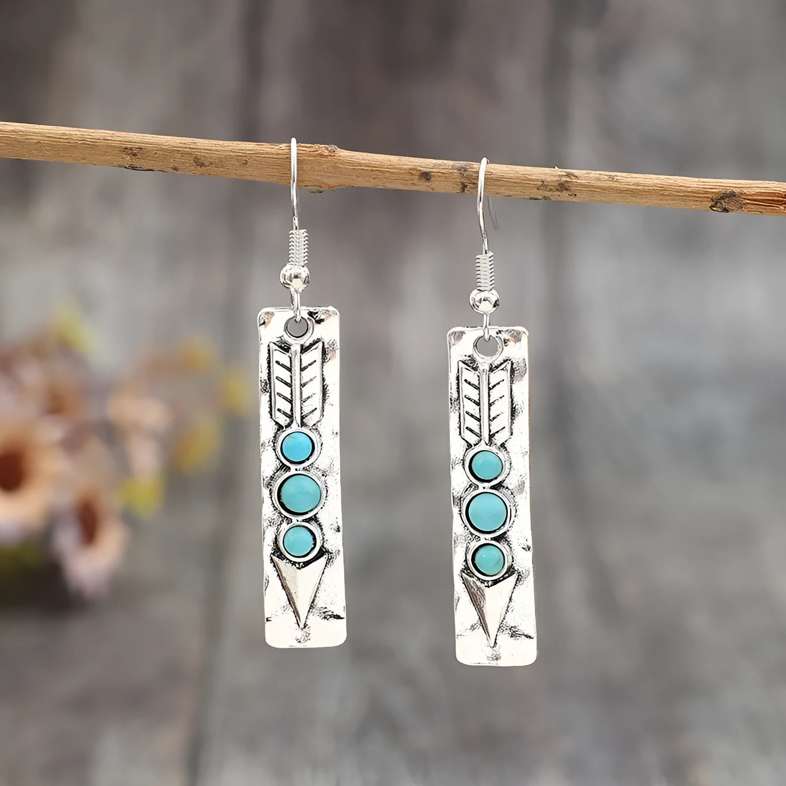 Silver geometric earrings with a long strip design and a blue turquoise inlay