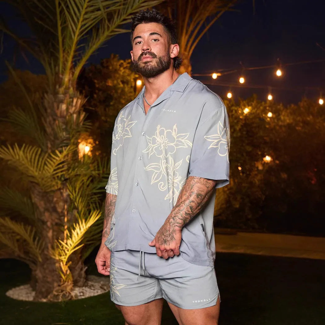 Men's loose floral print short-sleeve casual top in light colour on hanger