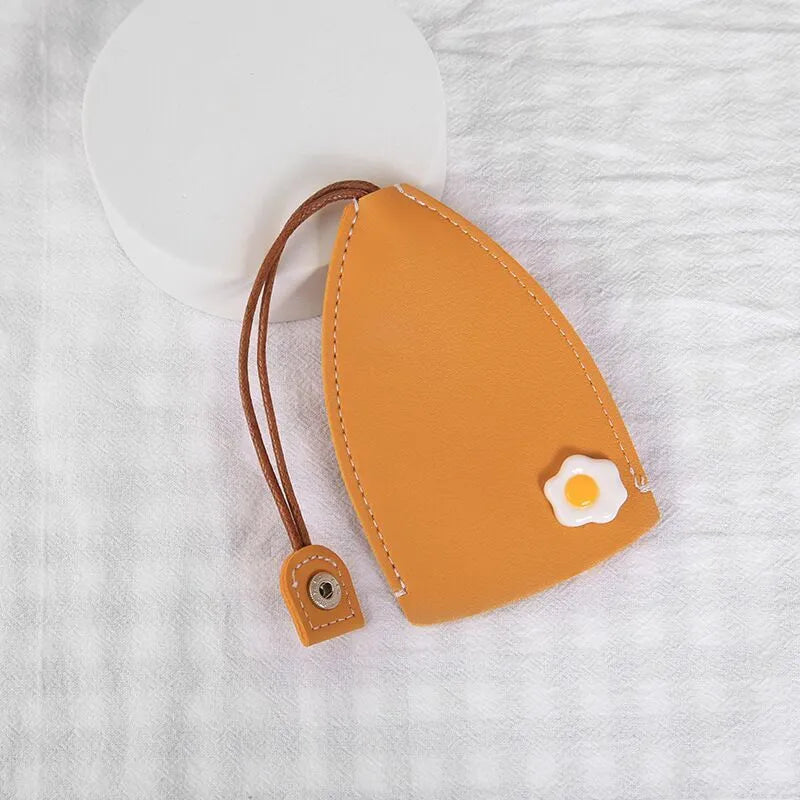 Cartoon pull-out key case in PU leather measuring 14 by 7.5 centimetres
