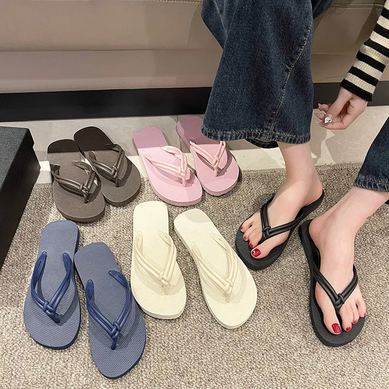 Men's PVC toe-covering flip flops in beige colour on a plain background.