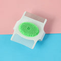 Blue and green multifunctional dog grooming comb with floating hair removal and massage feature