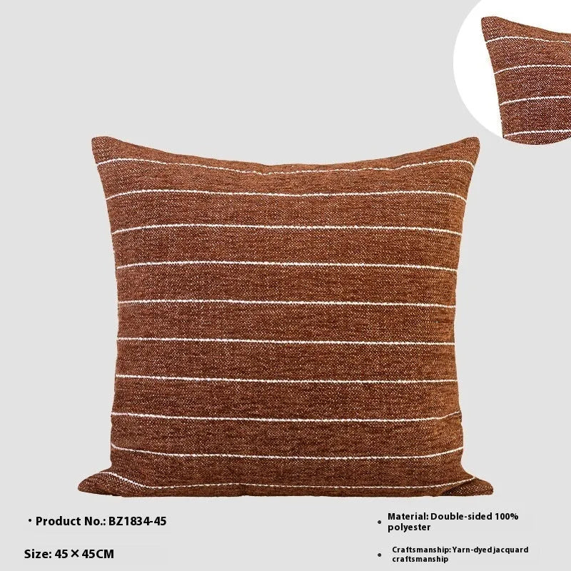 Chinese ancient style square pillow cushion in Maillard colours on a sofa.