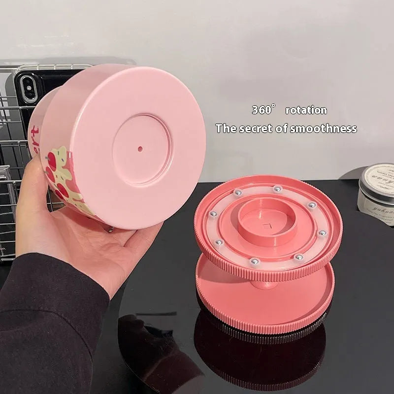 Beige rotating cosmetic brush storage barrel with 18-litre capacity on a table.