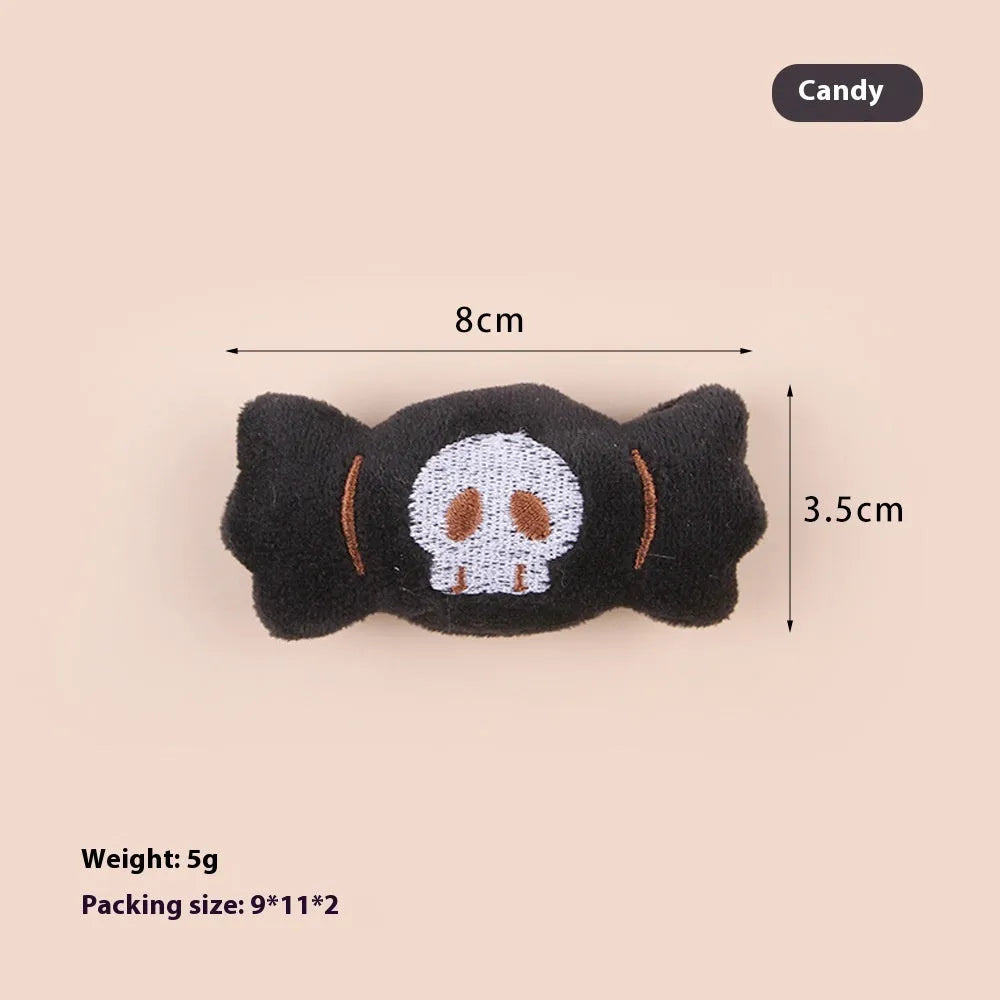 Small plush cat teaser wand with candy and skull designs for indoor play