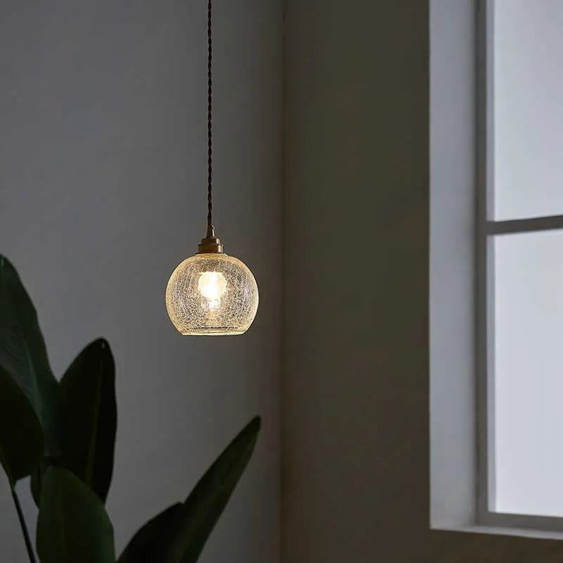 Brass and glass ball chandelier with copper body and clear spherical shade, shown in diamond colour.