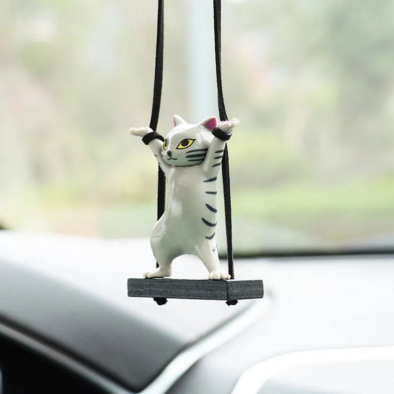 Cartoon-style resin cat pendant on an adjustable rope for car interior decoration.