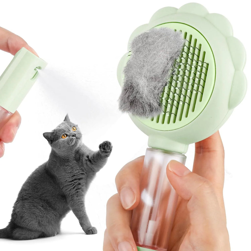Grey spray cat grooming brush with self-cleaning button and stainless steel bristles on a white background