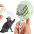 Grey spray cat grooming brush with self-cleaning button and stainless steel bristles on a white background
