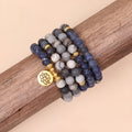 Blue multi-layer alloy bracelet with patterned network stone beads.