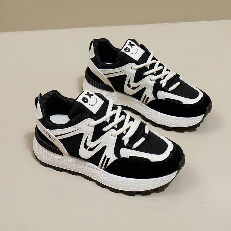 Women's black platform casual shoes with flat heel, round toe, and lace-up front on a white background.
