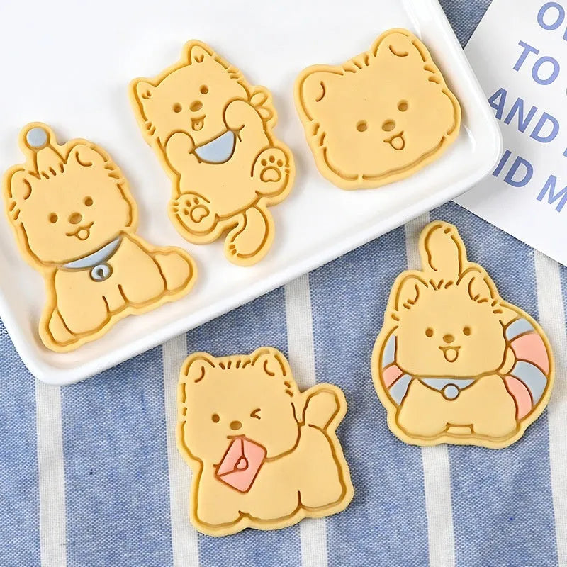 Three dimensional plastic puppy cartoon biscuit mould showing character designs
