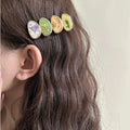 Forest Fairy side bangs hair clip for women in pink plastic and resin with Korean-style lines