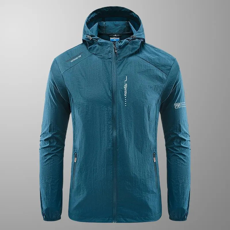 Man wearing a loose-fit light grey hooded nylon jacket for summer sun protection.