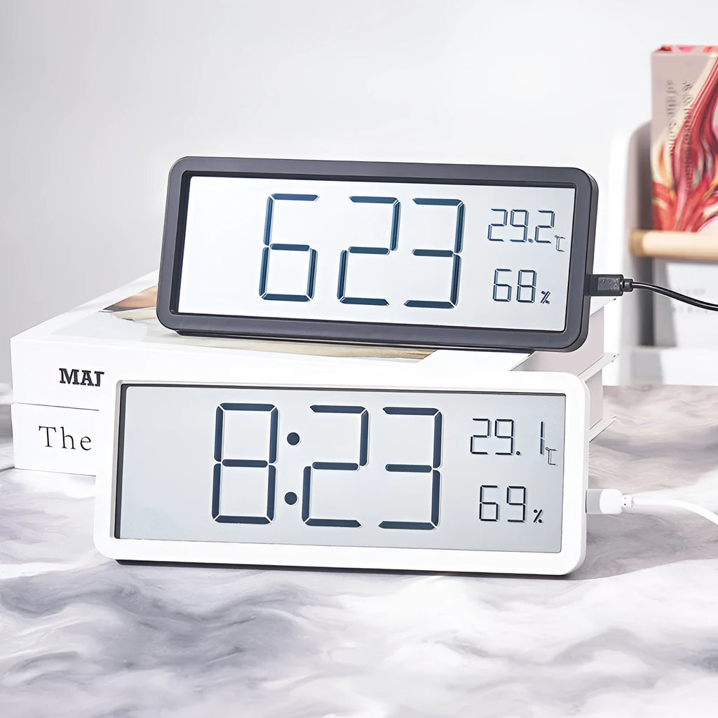 Simple large screen temperature and humidity clock in plastic with Nordic style, black colour, on a desk.