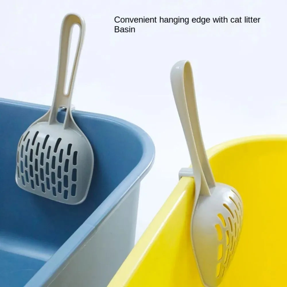 Grey plastic cat litter scoop with perforations and a separate storage base for cat litter box cleaning.