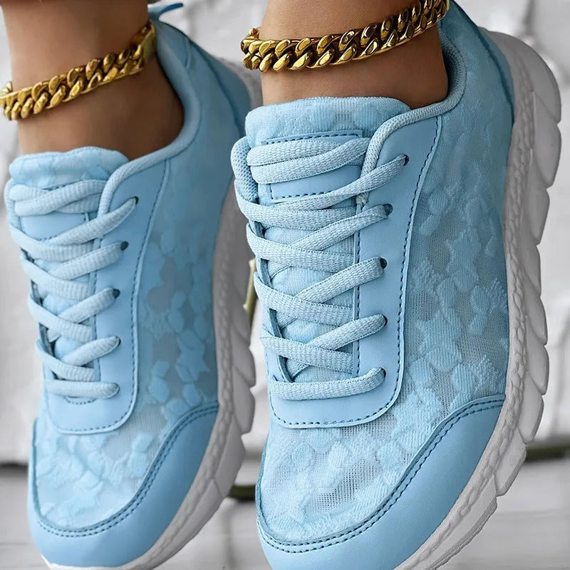 Women's canvas running shoes in white with round toe and flat heel design