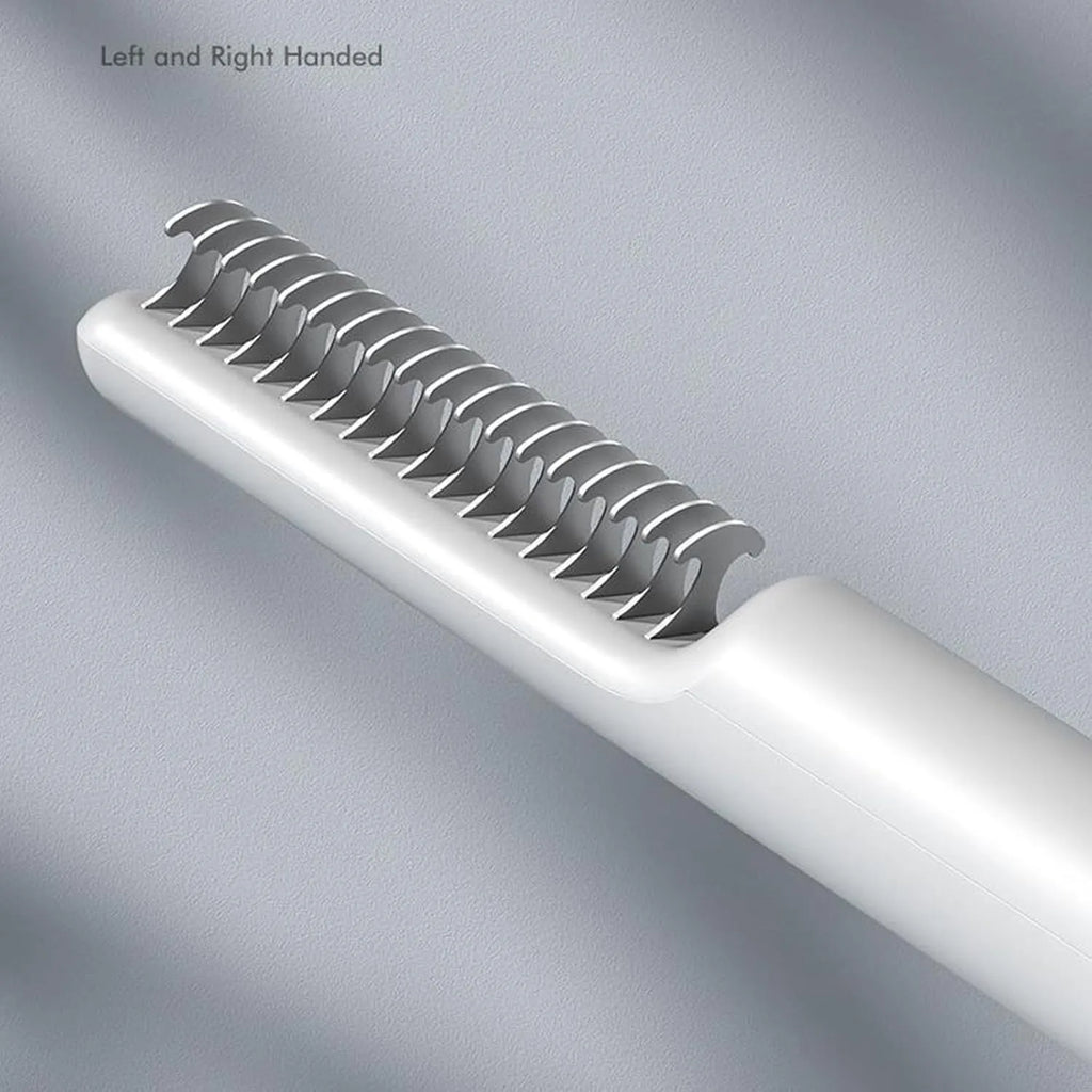 Stainless steel pet detangling comb with rake teeth on a pink handle for removing knots from dog hair.