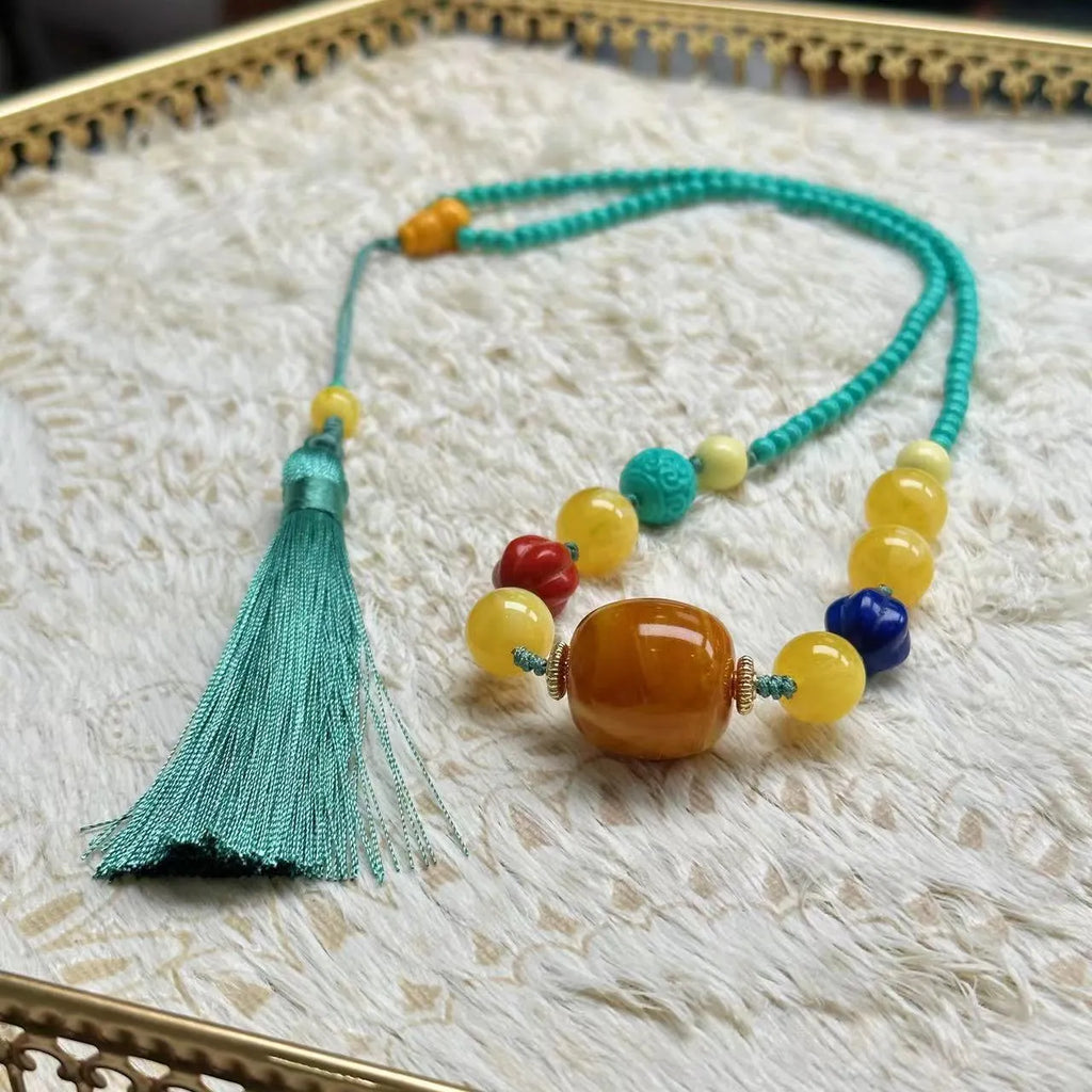 Turquoise stone pendant in hand-woven mesh flower setting on adjustable ball bead necklace chain